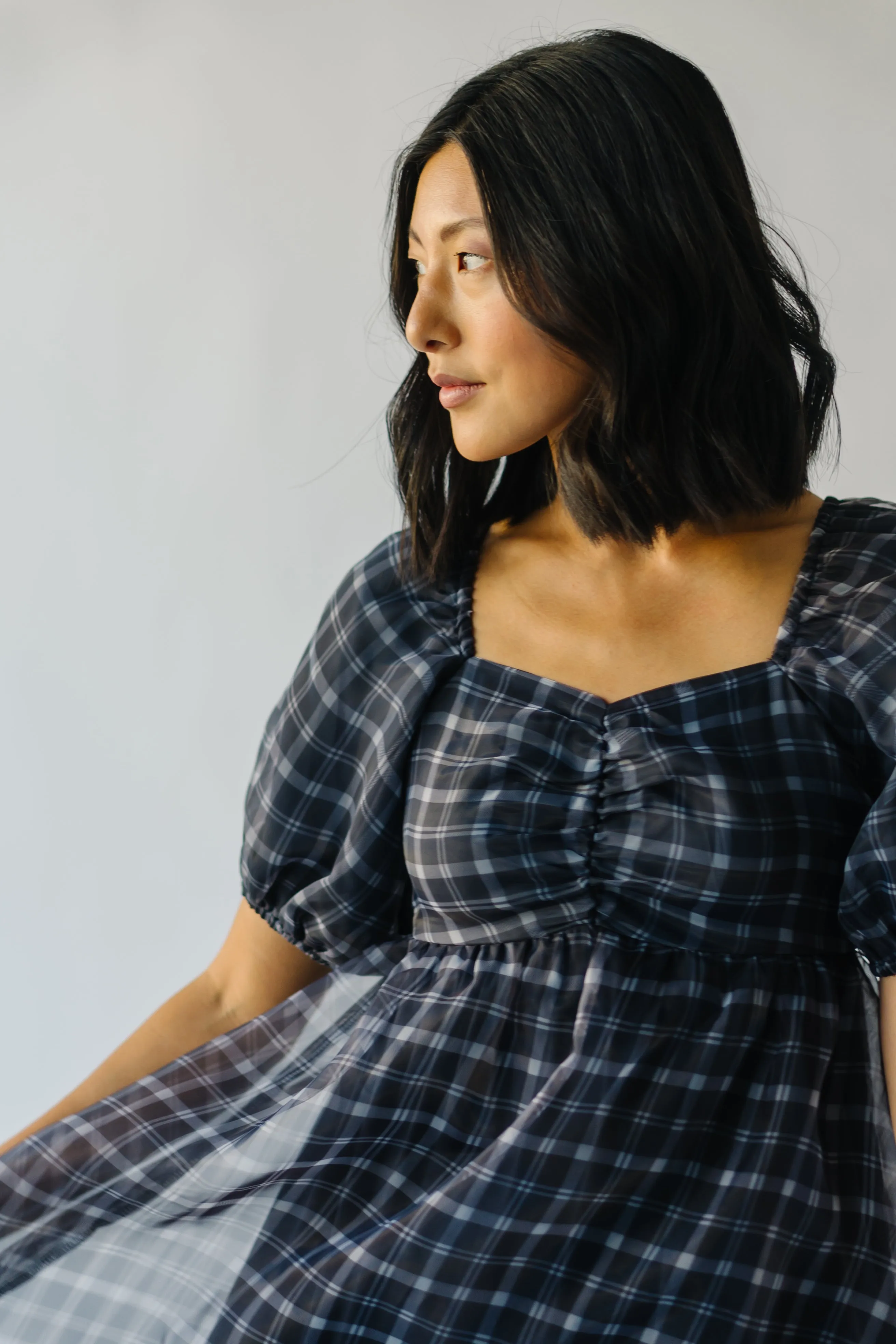 The Osburn Black Checkered Babydoll Mini Dress